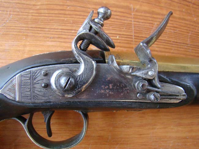 A pair of English flintlock brass barreled coaching pistols by John Bennett circa 1790 — image 4